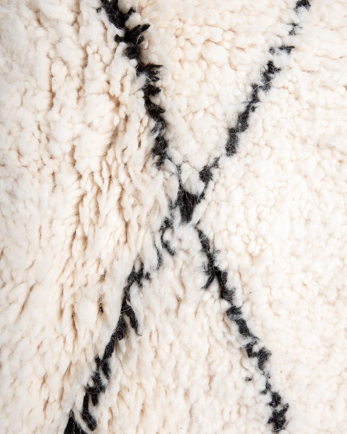 Modern, designer, handcrafted Berber rug from Morocco. Beniourain carpet with minimalist design, natural wool pile and a fluffy texture.